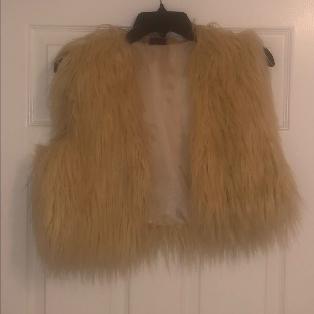 White fur vest
